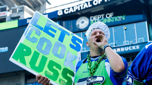 A Seattle Seahawks fan cheers against Denver Broncos quarterback Russell Wilson (not pictured) during pregame warmups at Lumen Field.